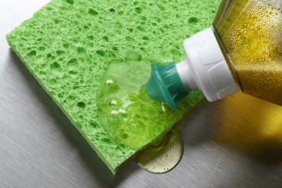 Cleaning Bottle Secrets Revealed Dish Soap on Sponge