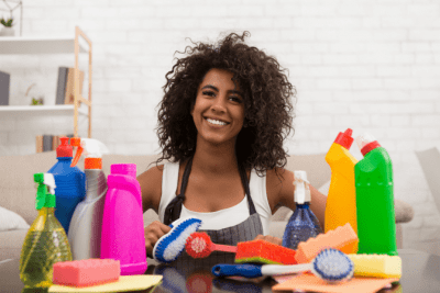 Cleaning Bottle Secrets Revealed Woman with Cleaning Supplies
