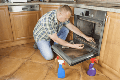 Remove Aluminum Foil, Man Cleaning Oven